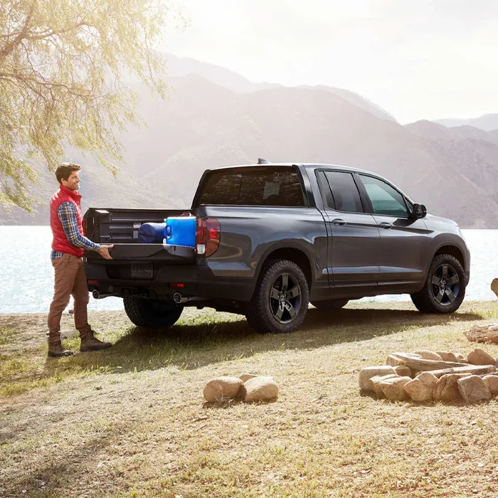 Man Grabbing Items From Trunk Bed of 2026 Honda Ridgeline