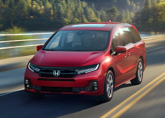Honda Odyssey driving down a highway