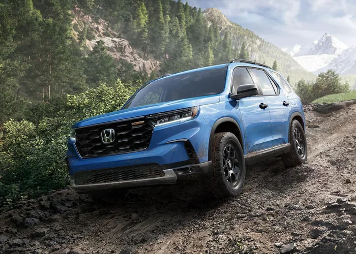 Honda Pilot Driving Down Dirt Road