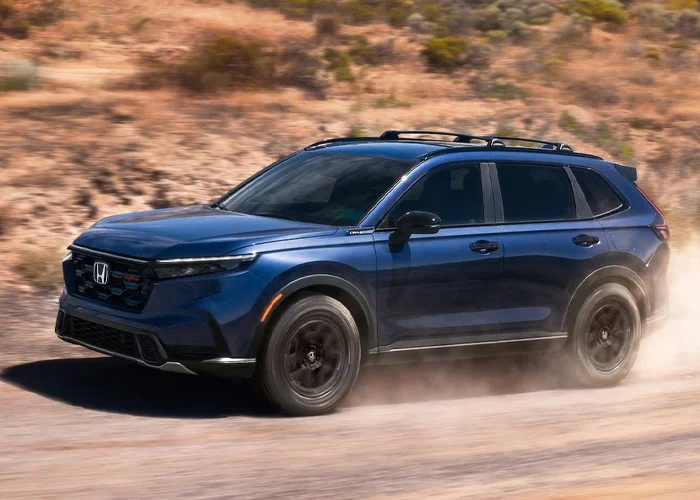 Honda CRV Driving Down a Dirt Road