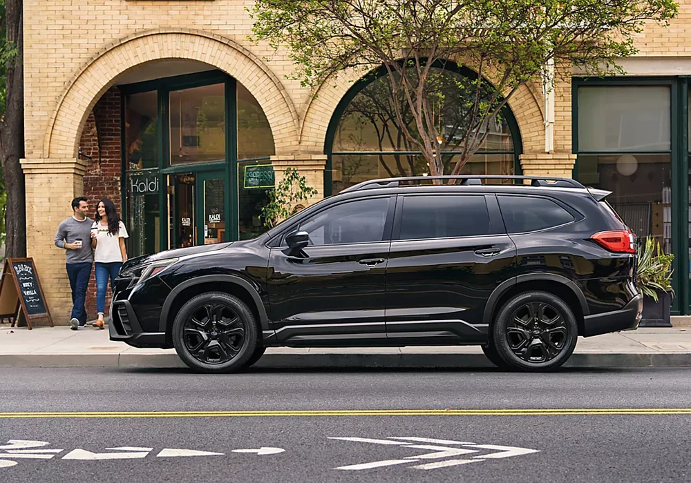 Couple Walking Up to Subaru