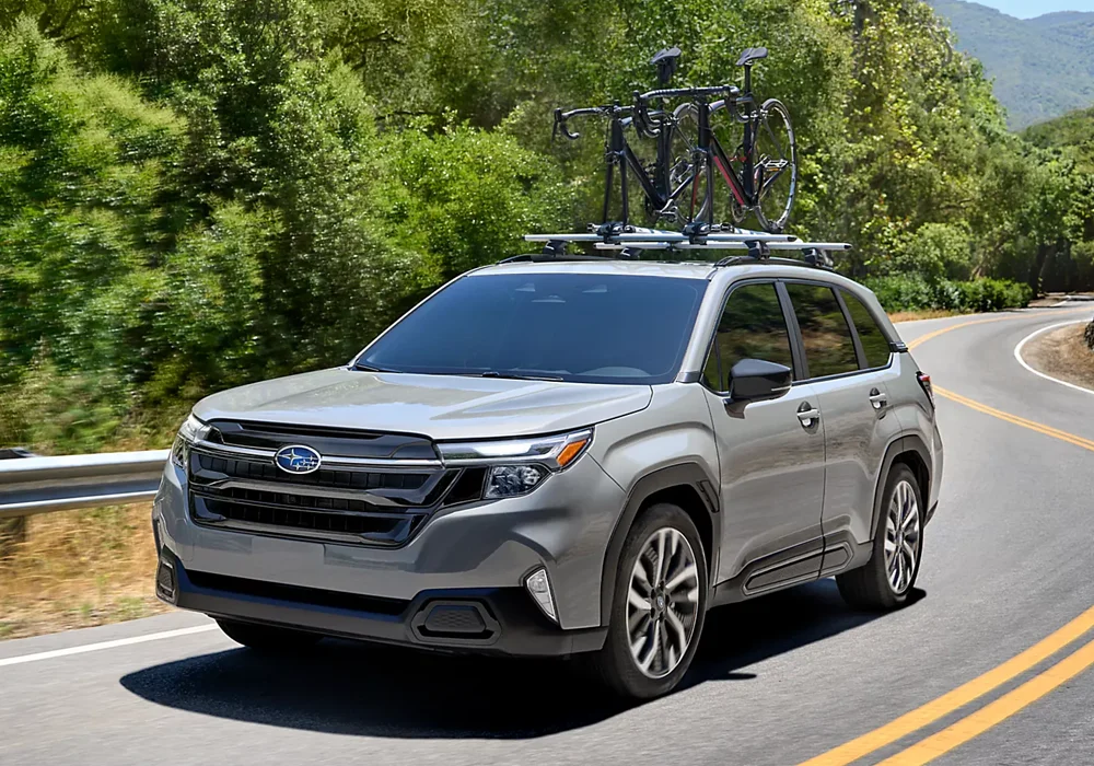 Forester With Bike Rack Driving Down Road