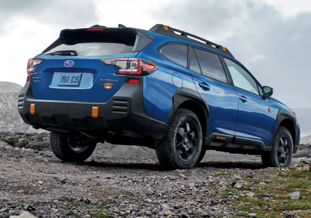 Subaru Outback parked near mountains