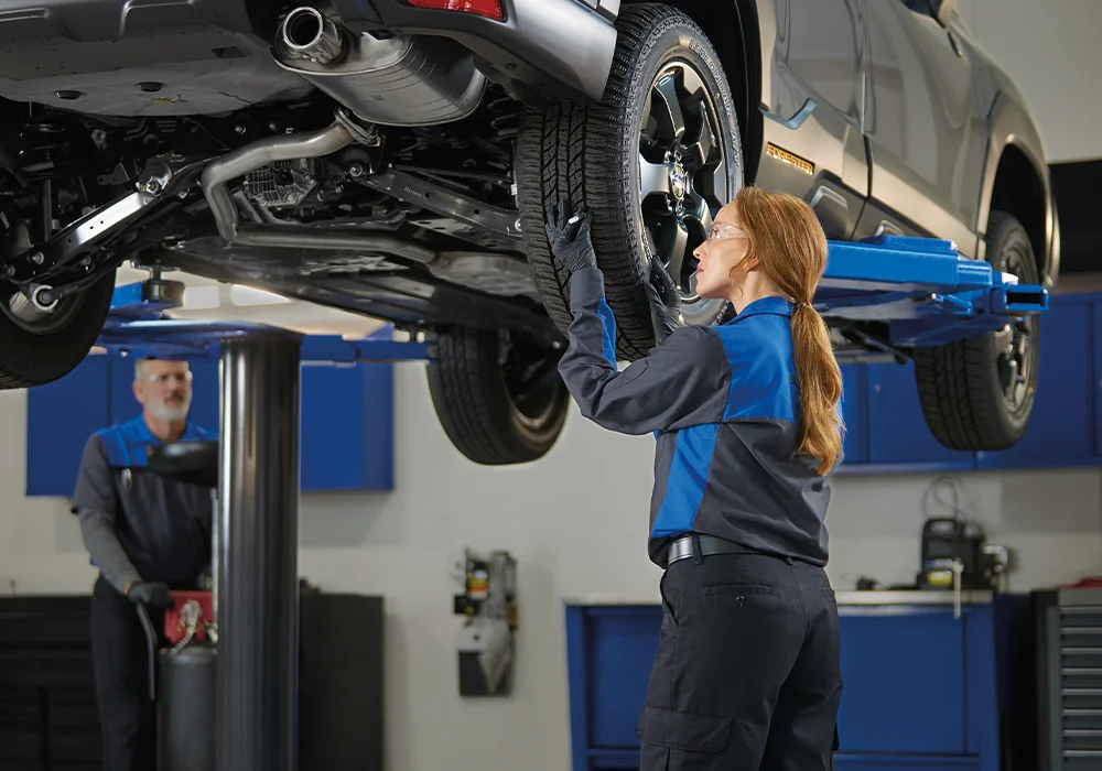 Subaru Techs working on a car